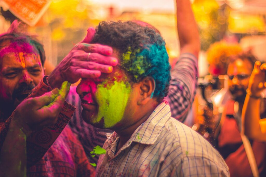 INIDAN MAN CELEBRATING HOLI